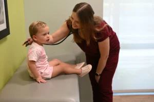 LAURA WISE, MD, FAAP with Patient