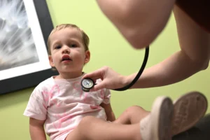 LAURA WISE, MD, FAAP with Patient