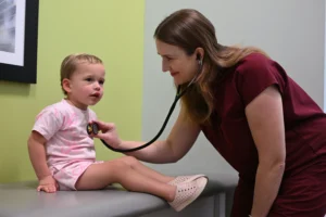 LAURA WISE, MD, FAAP with Patient