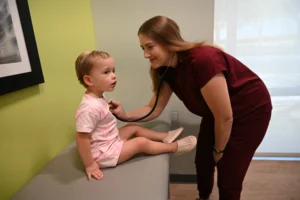 LAURA WISE, MD, FAAP with Patient