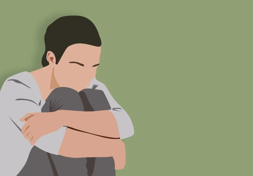 Illustration of a person sitting with knees tucked in and arms wrapped around them, against a plain green background, conveying a sense of sadness or introspection.